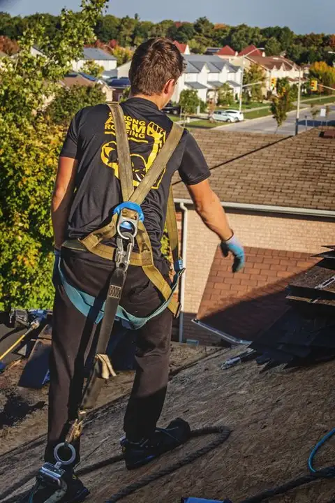 Steep-pitch roof section with new shingles