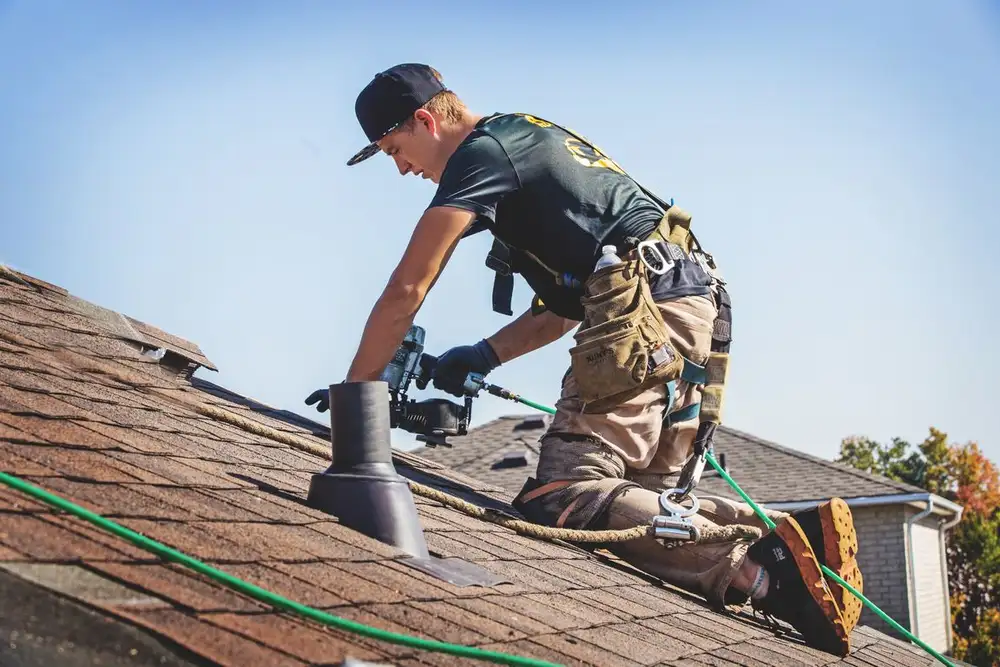 Completed roof replacement with dark shingles